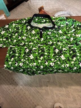 Men's Green Pixel Camo Polo Shirt with Contrast Collar. Brand new without tags